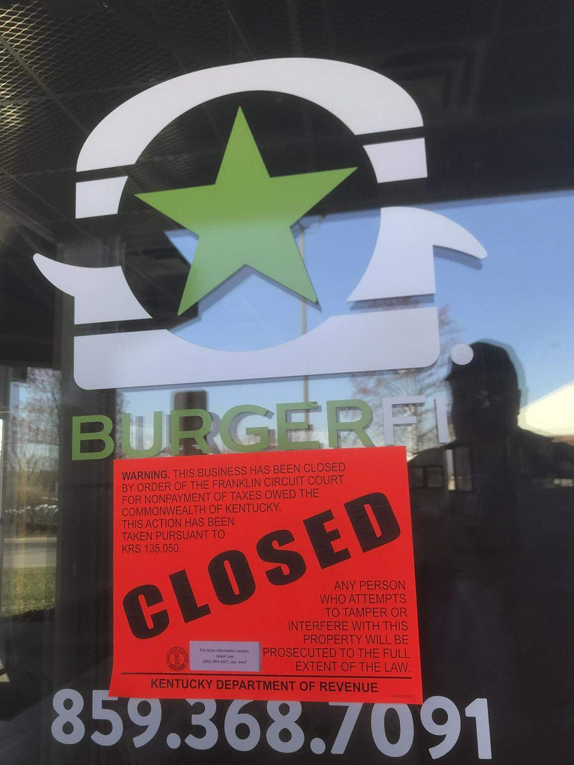 The BurgerFi location in Hamburg has signs on the door that say “This Business Has Been Closed By Order of the Franklin Circuit Court for Nonpayment of Taxes Owed the Commonwealth of Kentucky.” An eviction notice is also taped to the door.