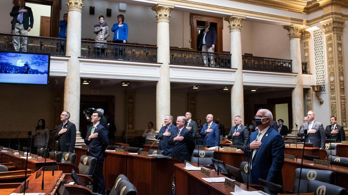 The Kentucky Senate stands for the Pledge of Allegiance on the second day of the General Assembly’s 2022 session at the Capitol in Frankfort.