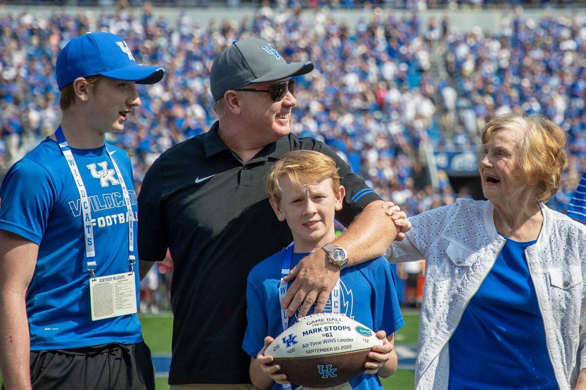 Kentucky Wildcats head coach Mark Stoops is honored, with his family, as the winningest head coach in Kentucky history before a game against the Youngstown State Penguins at Kroger Field in Lexington, Ky., on Saturday, Sept. 17, 2022.
