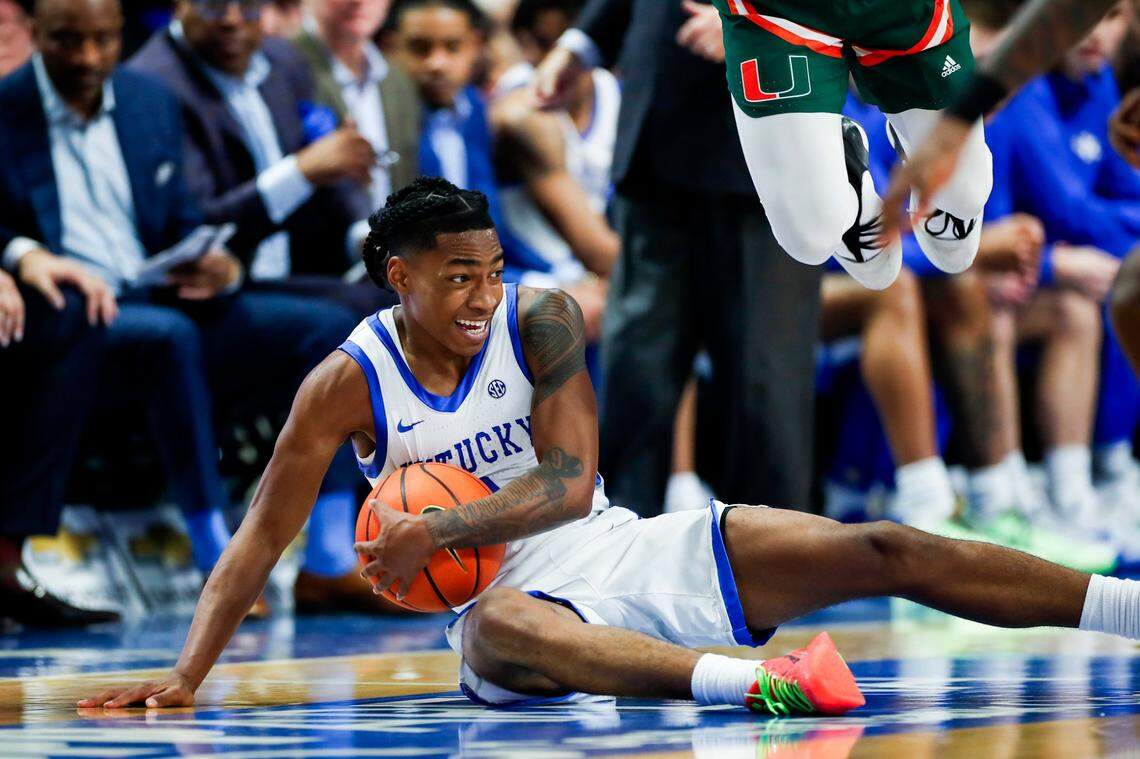 Kentucky guard Rob Dillingham dives for a steal against Miami during Tuesday’s ACC/SEC Challenge game at Rupp Arena. Dillingham finished the victory with a career-high nine assists and zero turnovers.
