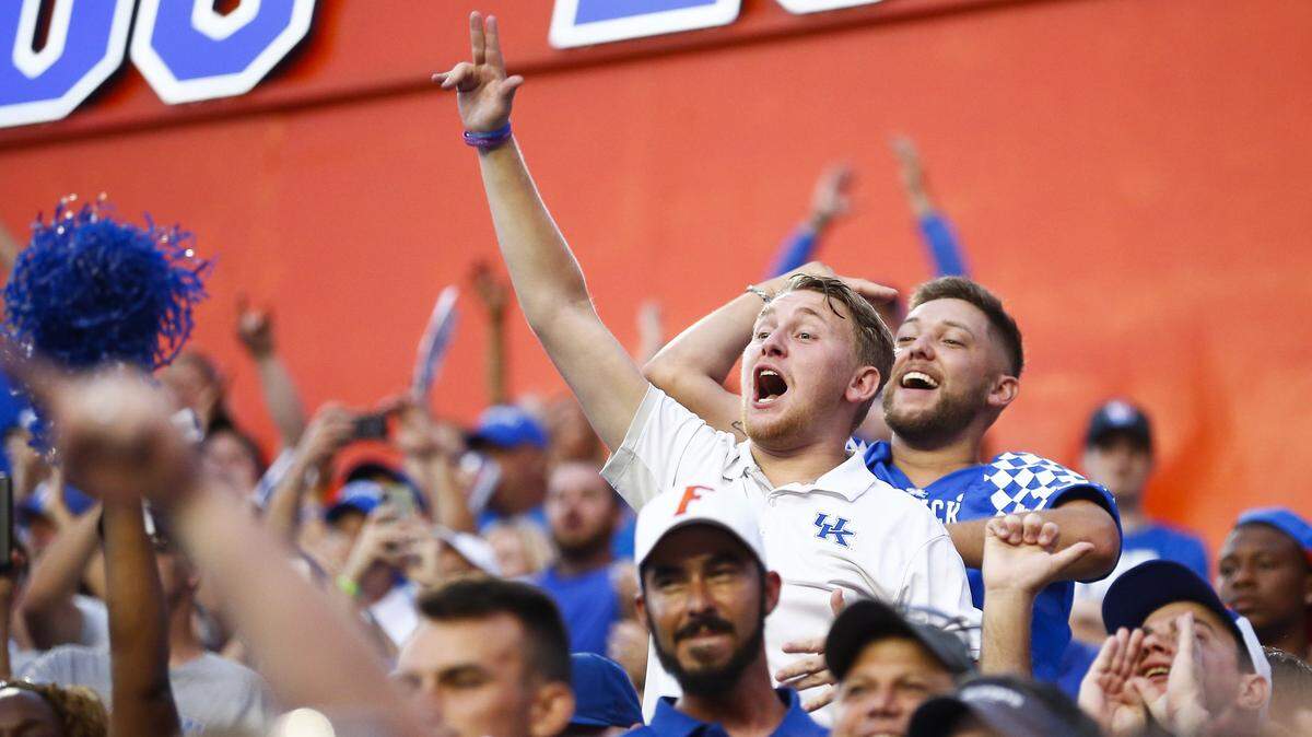 Kentucky Wildcats fans cheered in the stands during a game between the Kentucky Wildcats and the Florida Gators Saturday at Ben Hill Griffin Stadium in Gainesville. Kentucky beat Florida 27-16. 