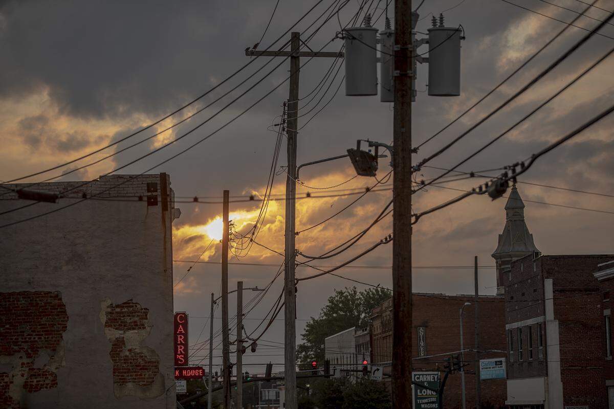 The sun rises in downtown Mayfield, Ky.