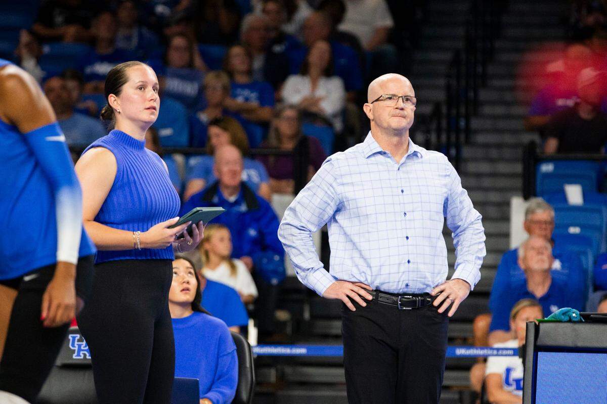 Kentucky volleyball assistant Merideth Jewell and head coach Craig Skinner watch their team play against Louisville on Sept. 18.