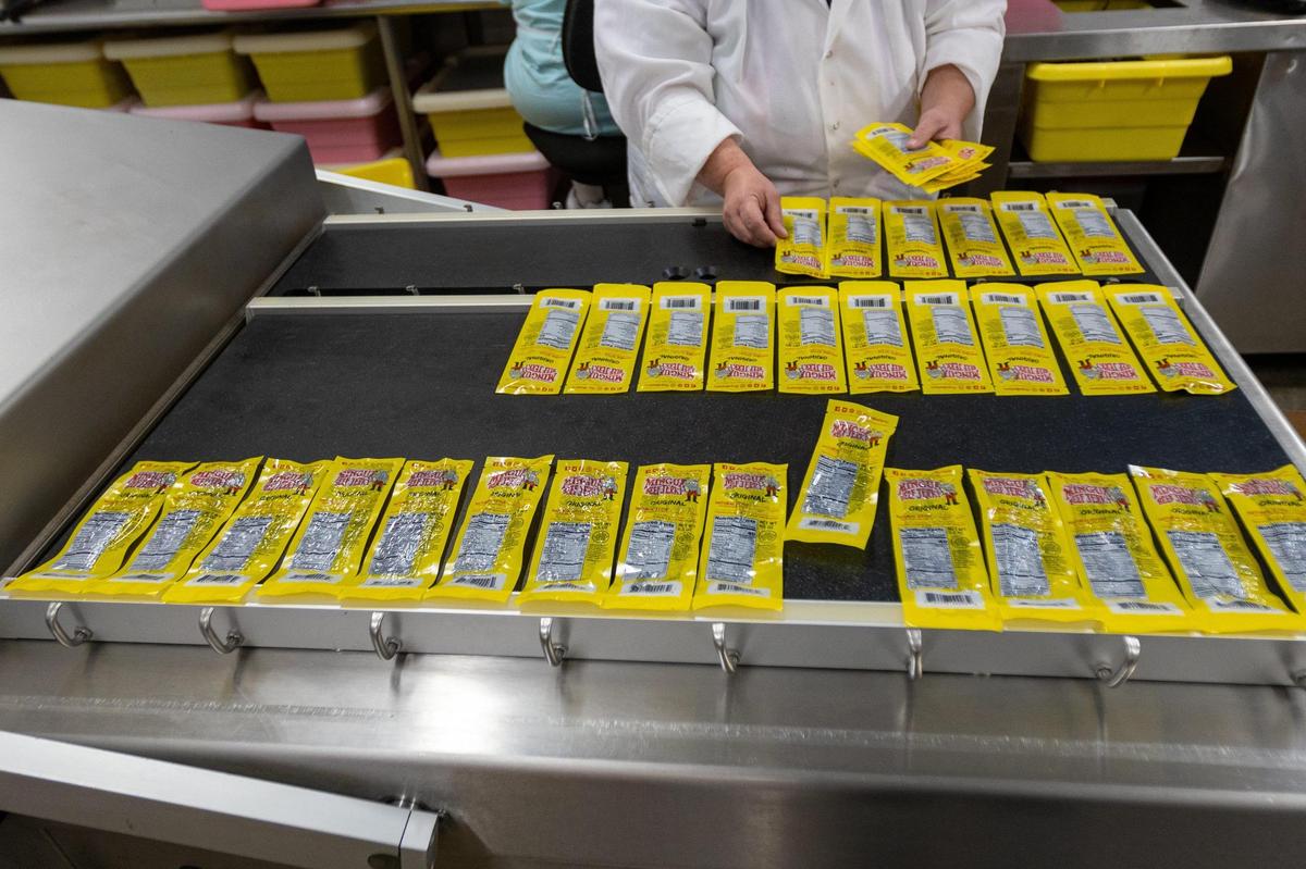Single strip jerky pieces laid on a bed before being sealed in their packages at the Mingua Beef Jerky facility in Paris, KY.