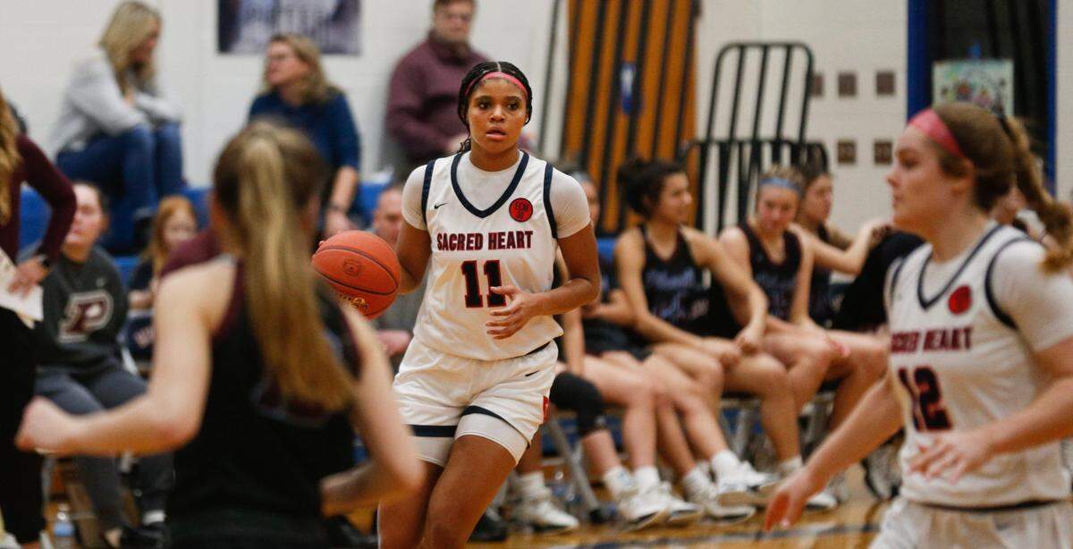 Sacred Heart's ZaKiyah Johnson brings the ball up court against Pikeville Saturday afternoon in Louisville.Feb. 17, 2024