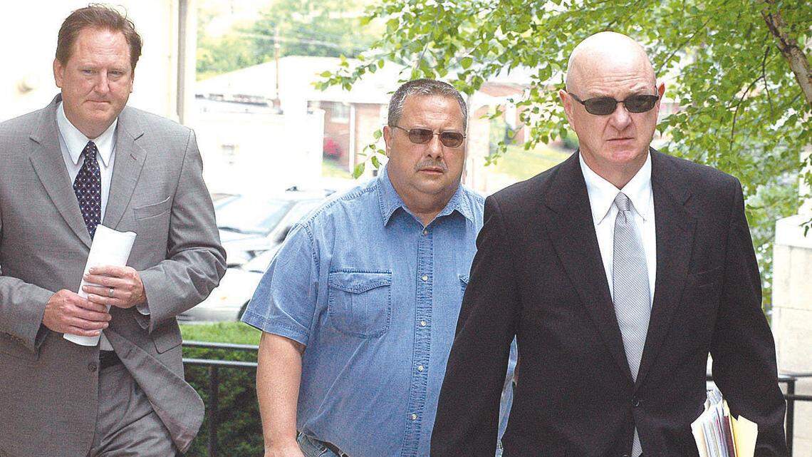 Lawrence Hodge, center, went to court Thursday flanked by his attorneys Brent Caldwell, right, and Jason E. Williams. Hodge has admitted guilt to several crimes, including drug offenses.