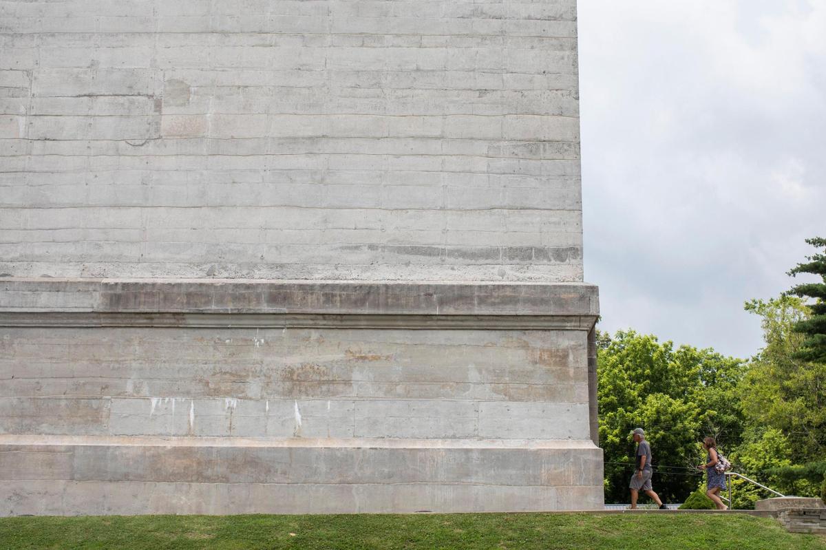 People walk to look inside the 351-foot obelisk memorial for Jefferson Davis at the State Historic Site in Pembroke, Ky., Thursday, July 8, 2021. Confederate States of America president was born in Todd County and the monument was created by the Orphan Brigade, with construction starting in 1917.