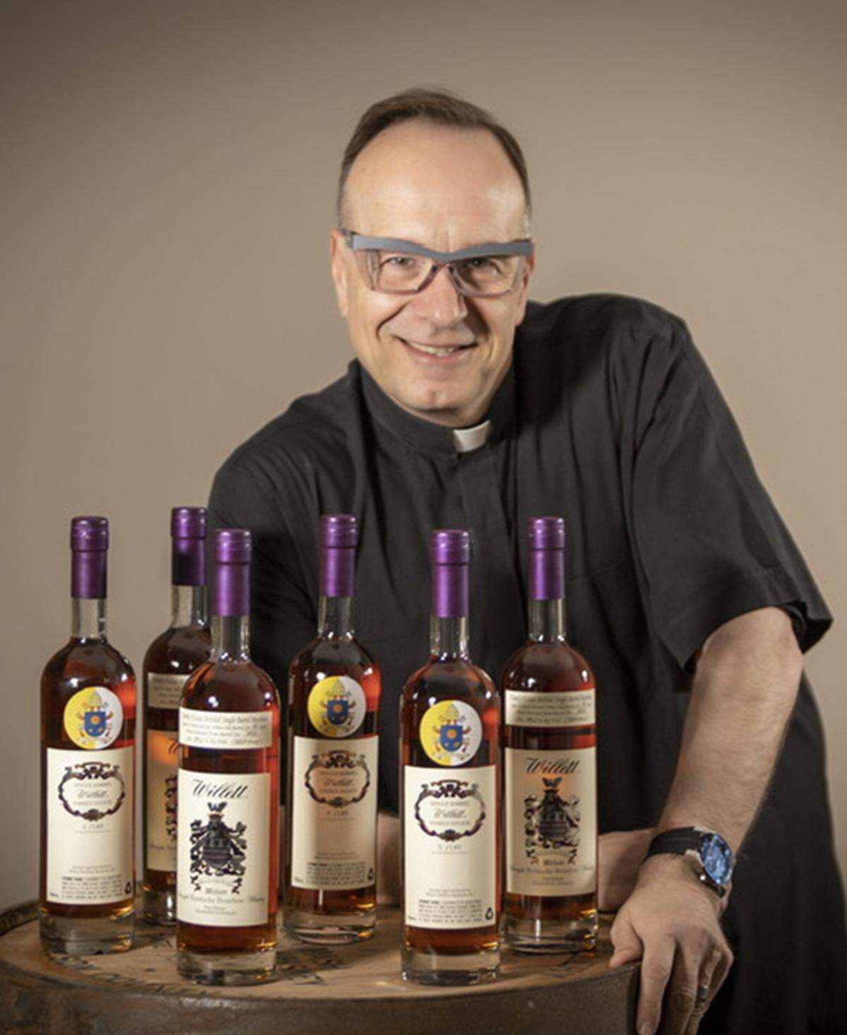 Father Jim Sichko with his Willett bourbon.