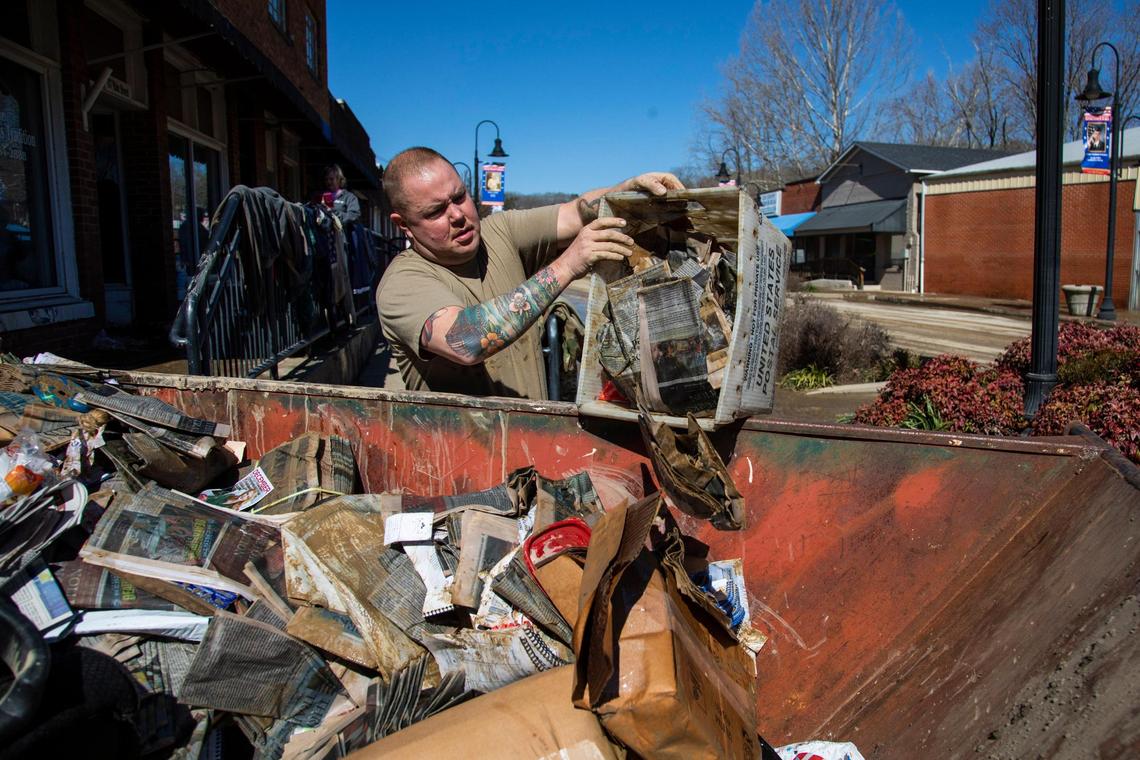 National Guard Specialist David Lynch, of 429 I company helps clean out the Three Forks Tradition office after severe flooding in downtown Beattyville, Ky, Wednesday, March 3, 2021. ÒNo question this is a catastrophic event,Ó said the director of Lee County Emergency Management Josh Allen said.