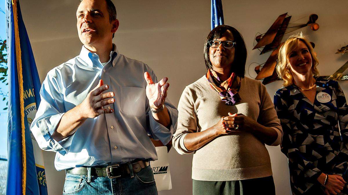 Republican Kentucky gubernatorial candidate Matt Bevin (from left) speaks Monday, November 2, 2015, in front of his running mate Jenean Hampton and Kelley Paul during a Republican rally at Bowling Green-Warren County Regional Airport. (Bac Totrong/photo@bgdailynews.com)