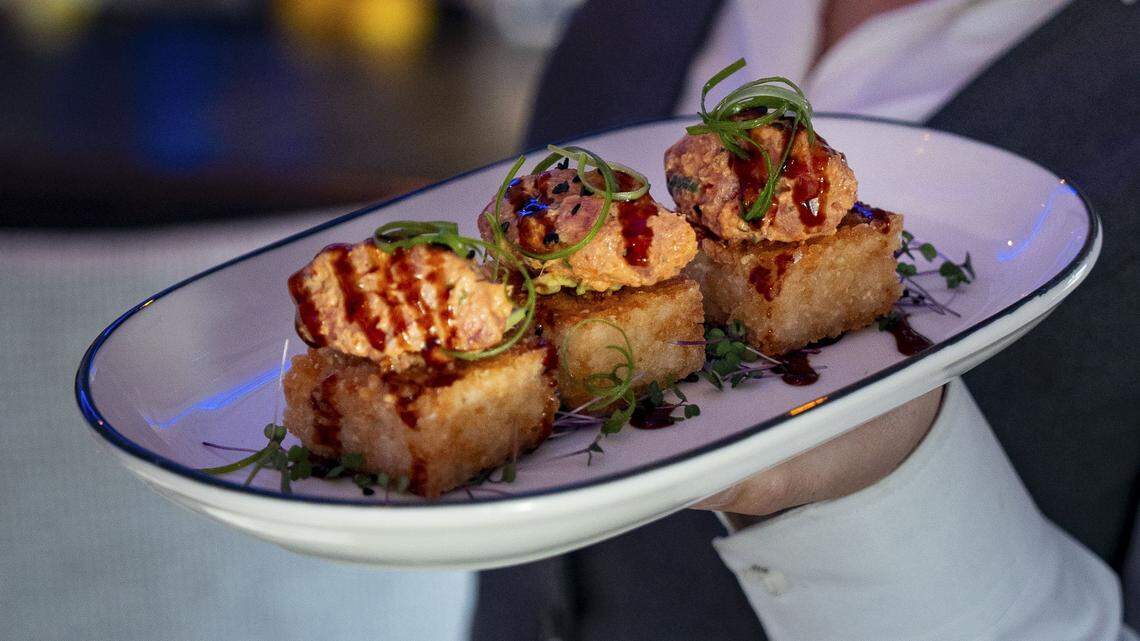 The spicy tuna appetizer with avocado, crispy sushi rice, sweet soy reduction, scallion and microgreens ($24) from The V, the public restaurant at The Vine, a new downtown Lexington development, photographed Friday, Sept. 5, 2025.