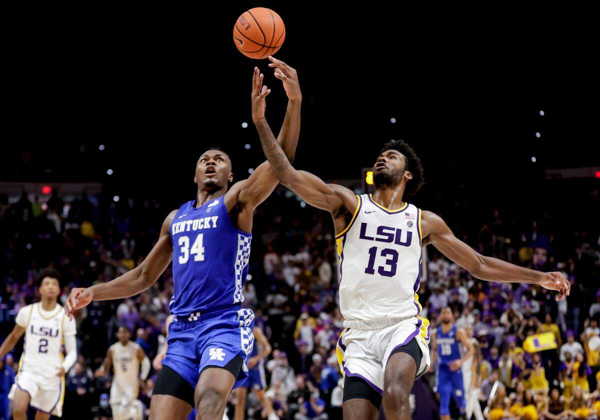 Kentucky star Oscar Tshiebwe (34) battled LSU forward Tari Eason (13) for the basketball in UK’s 65-60 loss at Baton Rouge last month. Tshiebwe had eight points and 13 rebounds in the game.
