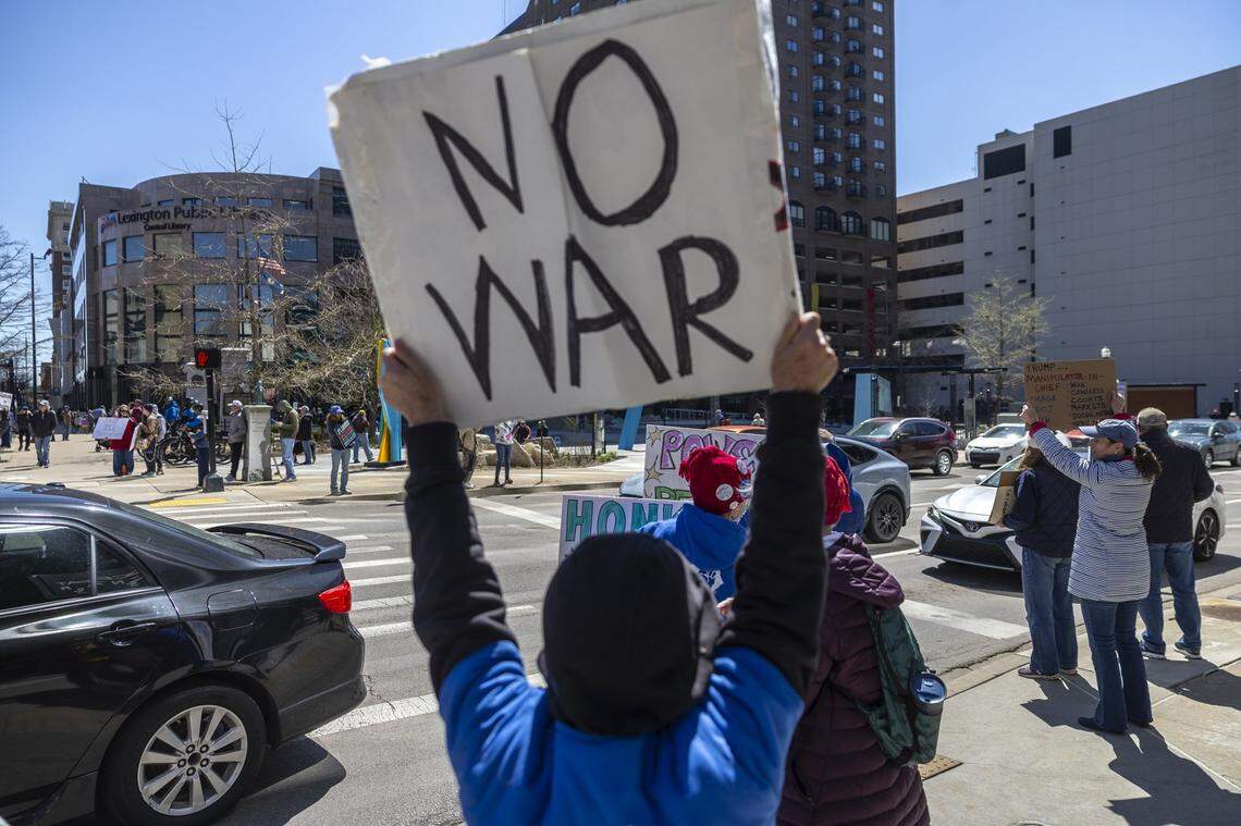 People attend a rally during a No Kings protest in downtown Lexington, Ky., on Saturday, March 28, 2026. 