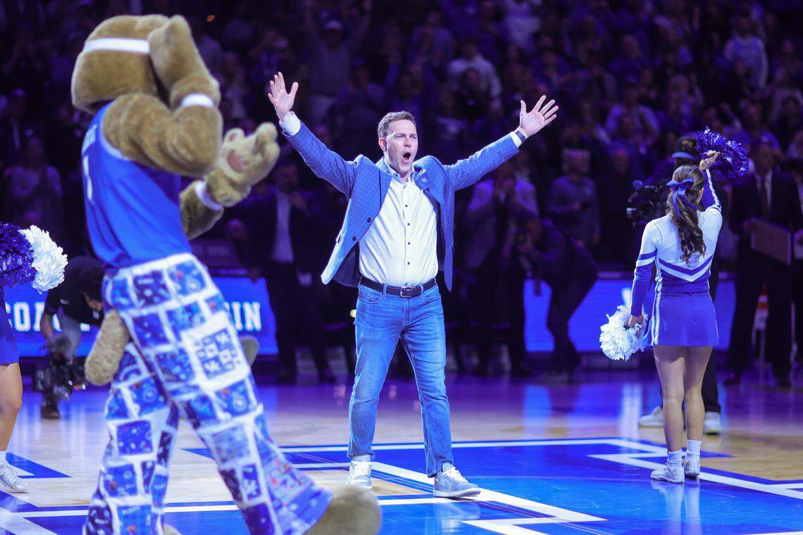 New Kentucky football coach Will Stein forms the Y in the UK cheerleaders’ traditional spelling of “Kentucky” in the first half of a game against North Carolina at Rupp Arena on Dec. 2, 2025.