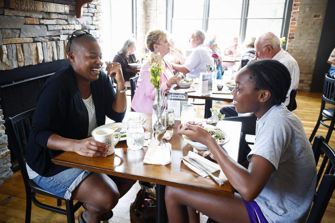 Kim Parker, of Boston, Mass., jokes with her niece Chloe Brown, 13, of Versailles, Ky., during brunch at Spark Community Cafe in Versailles, Ky., Sunday, June 23, 2019. Spark Community Cafe operates on a pay what you can scale and offers people an opportunity to volunteer time in exchange for their meal.
