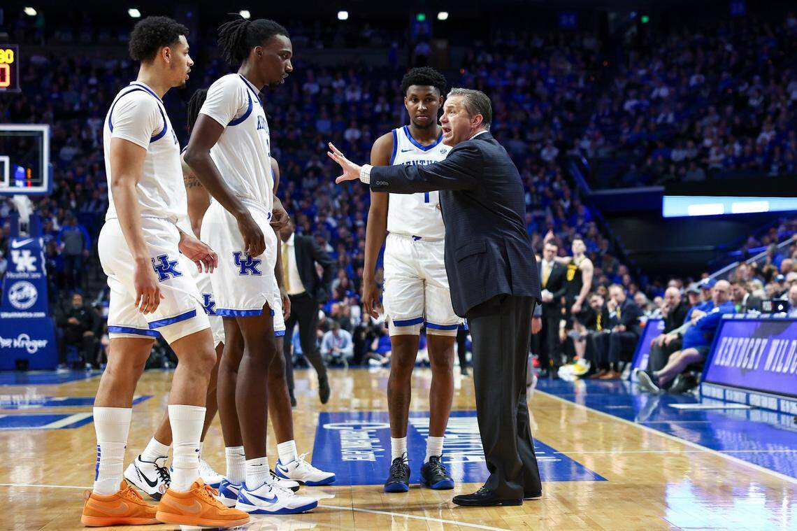 Kentucky head coach John Calipari talks with his players during Tuesday night’s game in Rupp Arena, the Wildcats’ sixth win in a row.
