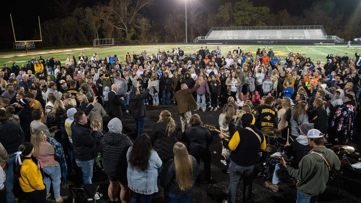 Hager Hill Freewill Baptist Church Pastor the Rev. Ronnie Spriggs delivers a sermon on the football field at Johnson Central High School Nov. 6, 2025, in Paintsville.