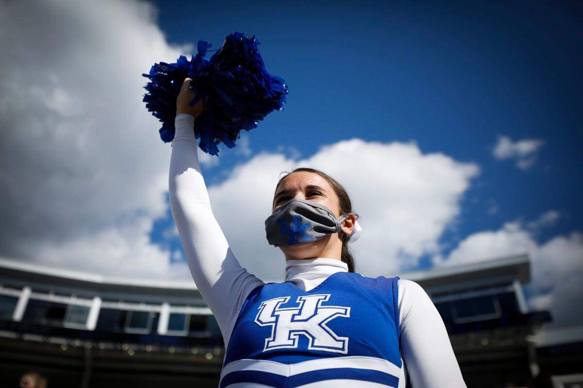 A Kentucky cheerleader cheered from the stands during Saturday’s game between Kentucky and Mississippi at Kroger Field.