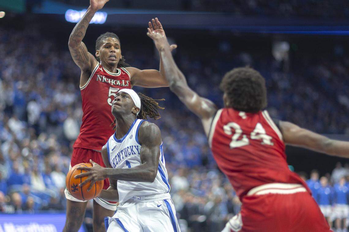Kentucky guard Denzel Aberdeen (1) shoots the ball around Nicholls forward Sincere Malone (5) during Tuesday’s game at Rupp Arena.