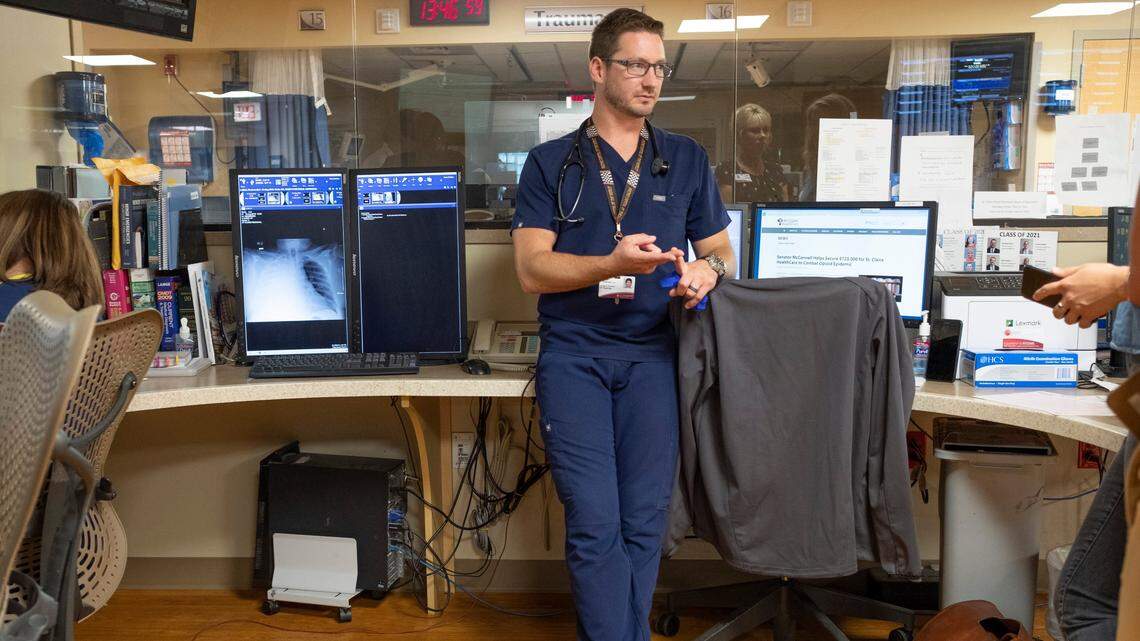 Dr. Philip Overall, emergency room director at St. Claire Hospital in Morehead. Ky, leans against his desk late on a Saturday night in September while he waits for a patient labs to return. For the past two-and-a-half years, he has spearheaded a new policy that has cut opioid prescription rates in his department by half.
