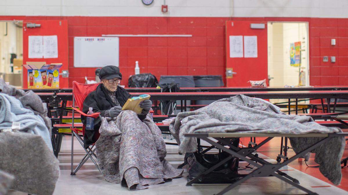 Wilma Sizemore, of Tyner, reads her Bible to pass the time at a warming station set up at the Tyner Elementary school after she lost power at her home in Jackson County Jackson, Ky., Wednesday, February 17, 2020. With a winter storm rolling in, here’s where you can seek shelter in Lexington and elsewhere.