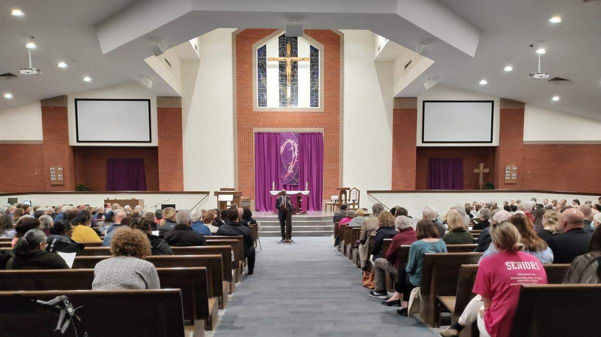 Rev. Richard Gaines, of Consolidated Baptist Church, addressed the crowd at the BUILD rally at Mary Queen of the Holy Rosary Catholic Church in Lexington, Ky., Tuesday night.