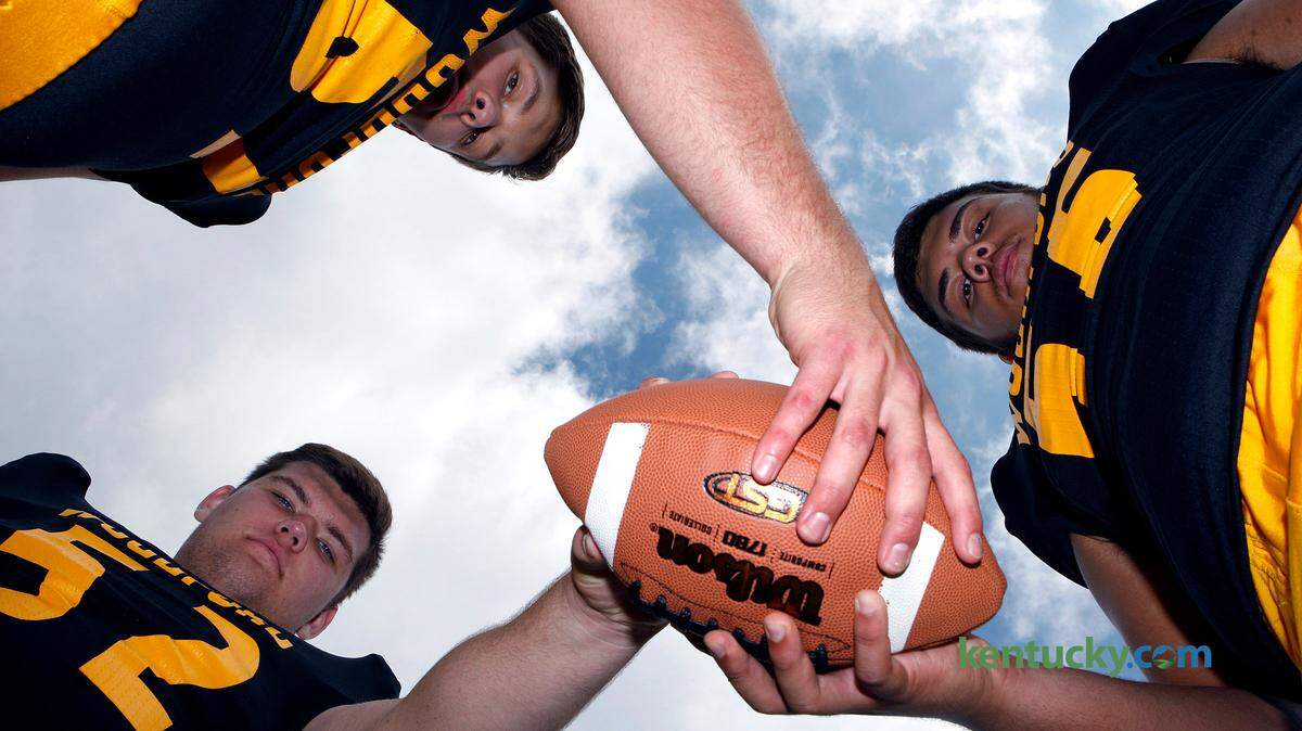 Woodford County offensive linemen Drake Jackson, left, Seth Joest and Saige Young. Photo by Matt Goins