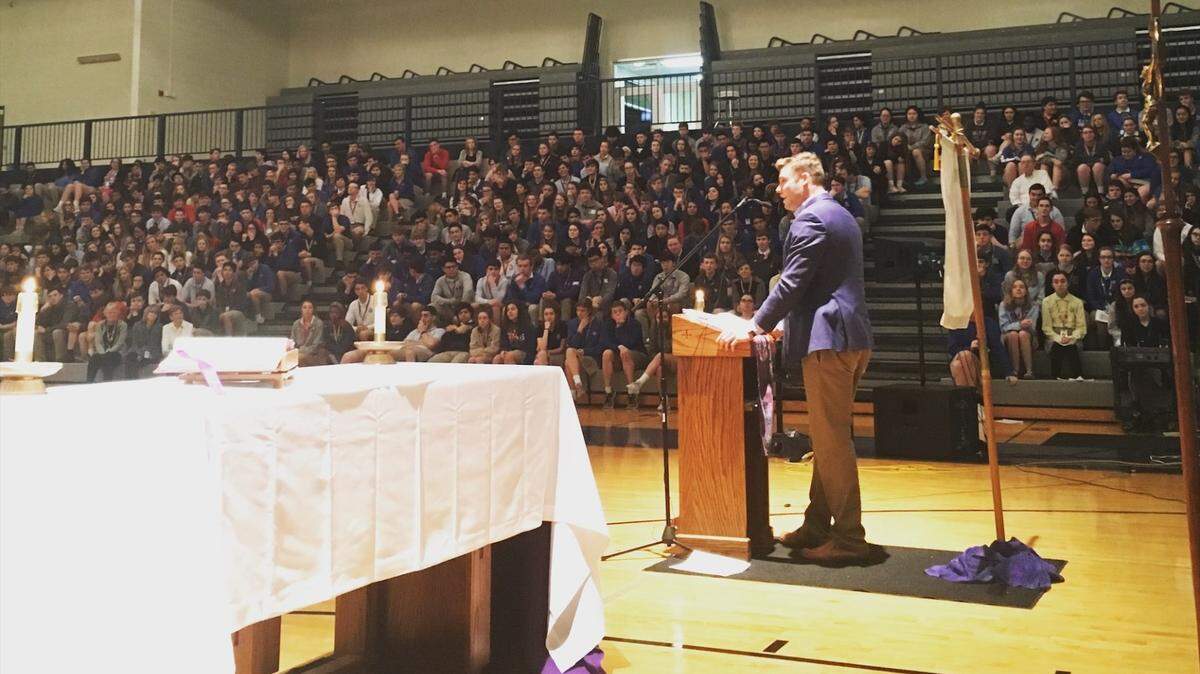 Former Kentucky Wildcats starting quarterback Patrick Towles speaking to a religious assembly at Lexington Catholic High School in 2019. Towles, 27, now works for the Fellowship of Catholic University Students, known as FOCUS, at Ohio State University.