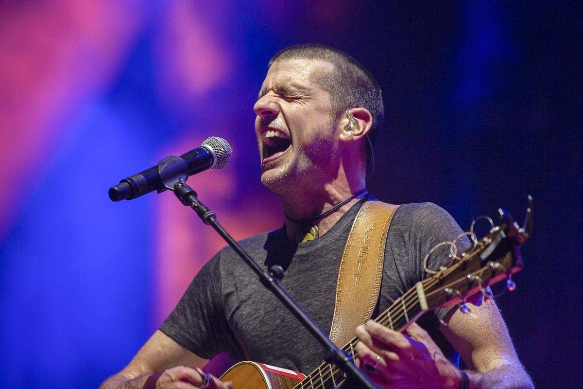 “This isn’t a facade of working together with one pulling the strings or the other being more forceful than the other,” said Seth Avett of the Avett Brothers, shown singing July 14 during the Forecastle Festival in Louisville.