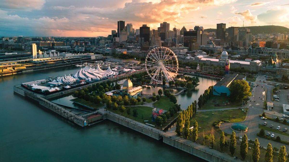 View of the Old Port of Montreal. The  historic port of Montreal is located in Old Montreal and stretches for over two kilometres (about 1.2 miles) along the St-Lawrence River.