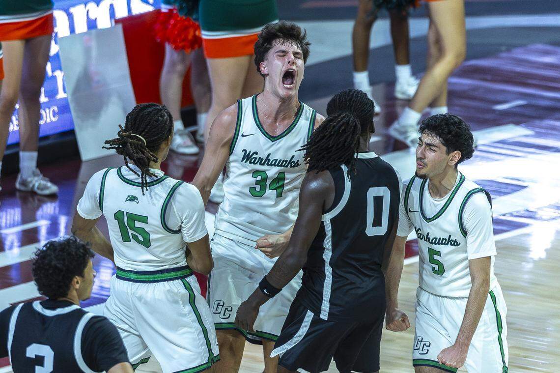 Great Crossing's Brady Orem (34) reacts after scoring a basket during the Boys 11th Region Tournament championship game against Frederick Douglass at Eastern Kentucky University's Baptist Health Arena in Richmond, Ky., on Monday, March 9, 2026.