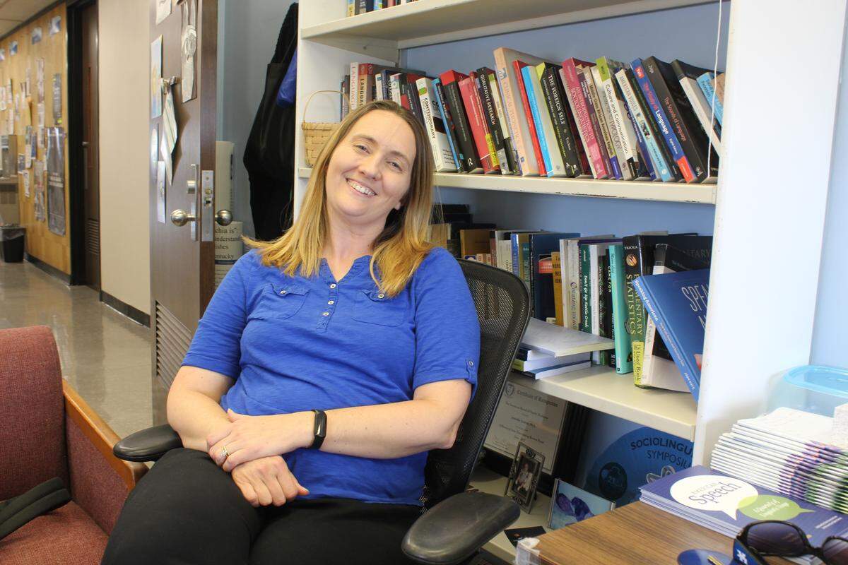 Jennifer Cramer, treasurer and former president of the American Association of University Professors, and linguistics professor at the University of Kentucky, smiles in her office on April 22, 2026.