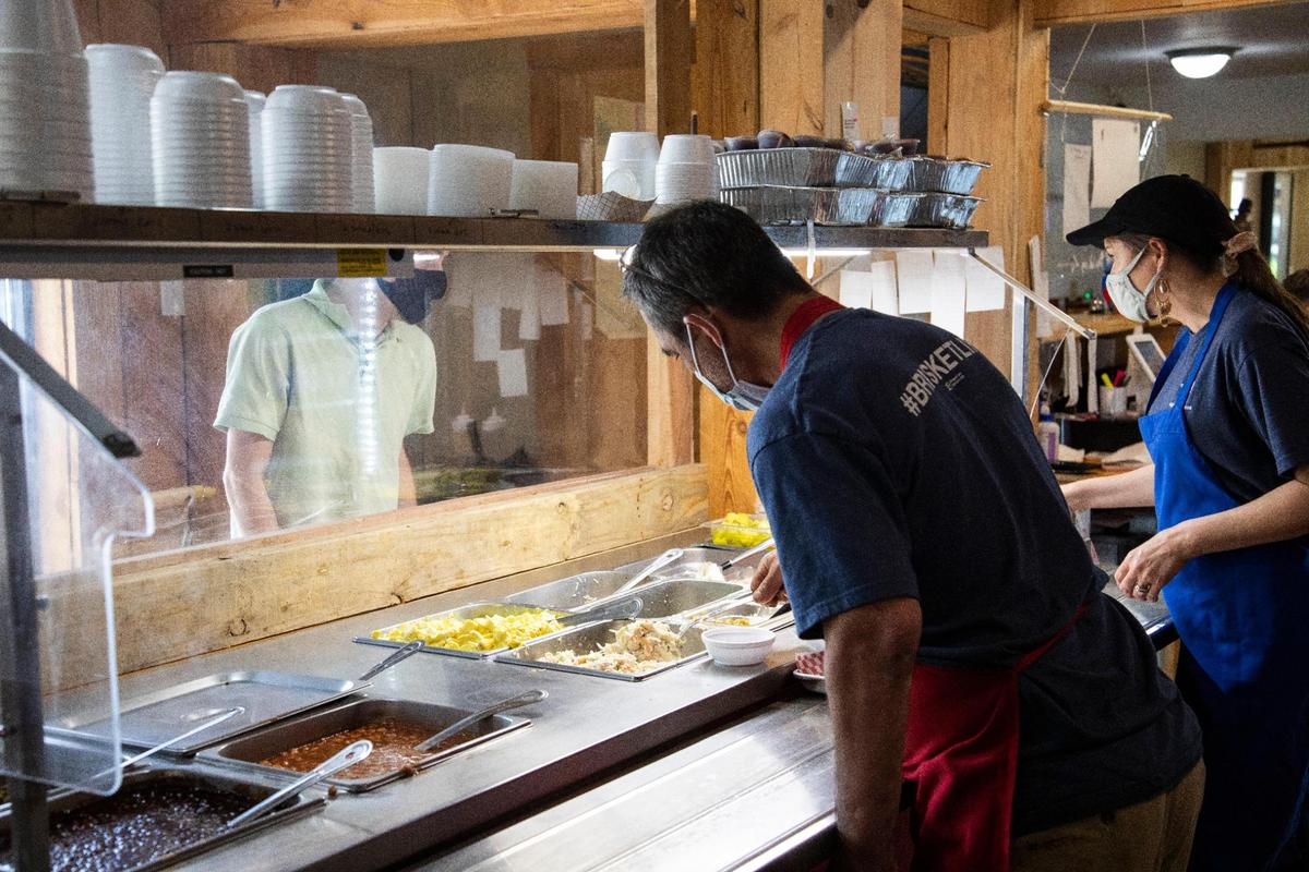 Owner Paul Morin works serving food and cutting brisket at Straight from Texas Bar-B-Que in Richmond, Ky., Thursday, May 6, 2021. 
