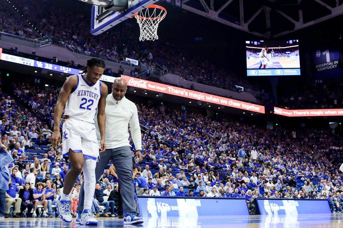 Kentucky guard Cason Wallace (22) walks off the court after suffering an injury against Vanderbilt early in the second half Wednesday at Rupp Arena.