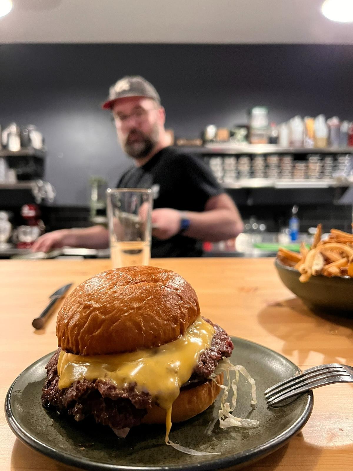 The burger made by chef Wyatt Sarbacker with dry-aged Kentucky beef is available at Favor behind Arcadium.