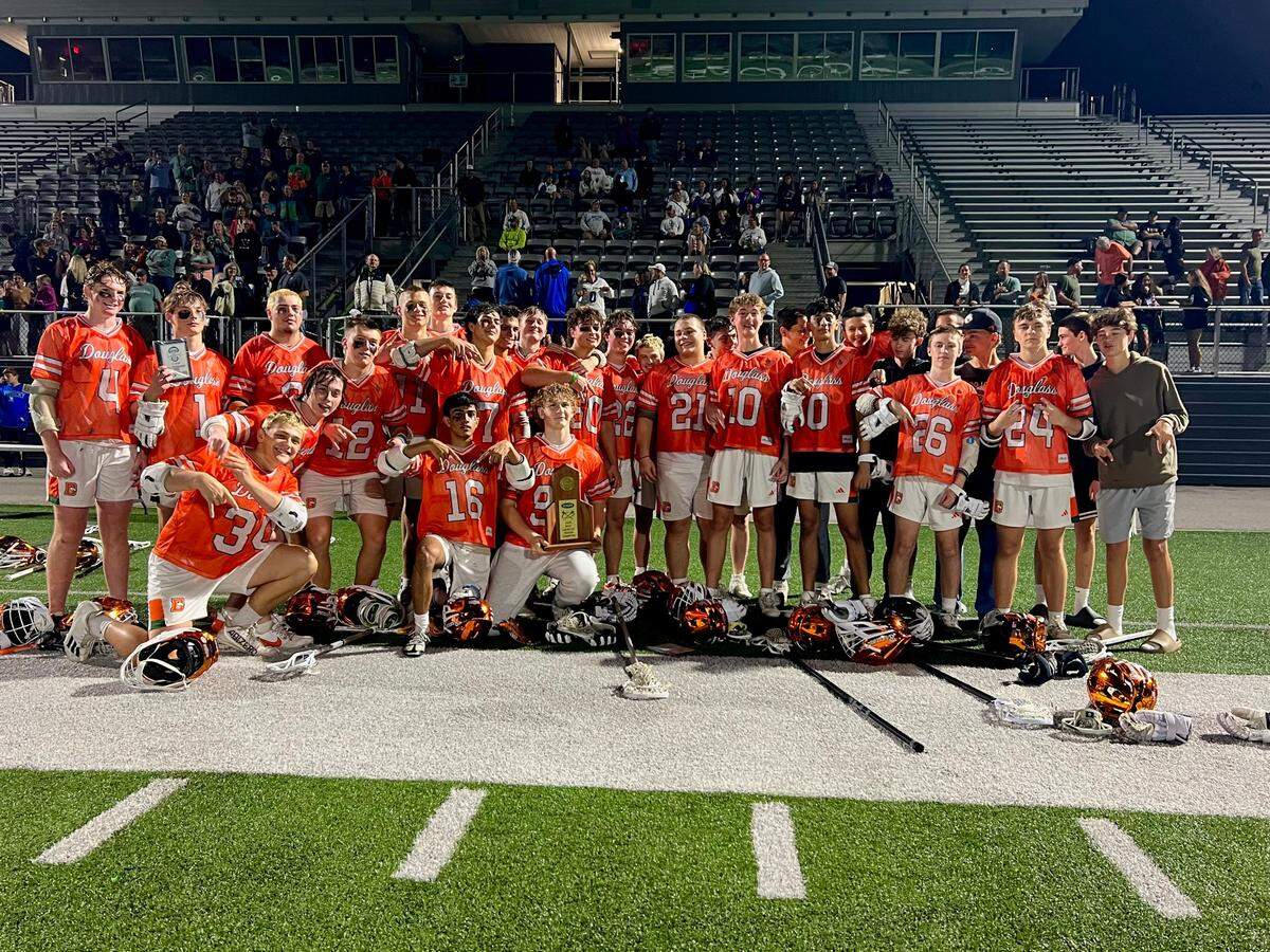 Frederick Douglass celebrates defeating rival Henry Clay 10-2 in the 7th Region boys lacrosse championship on Monday night.