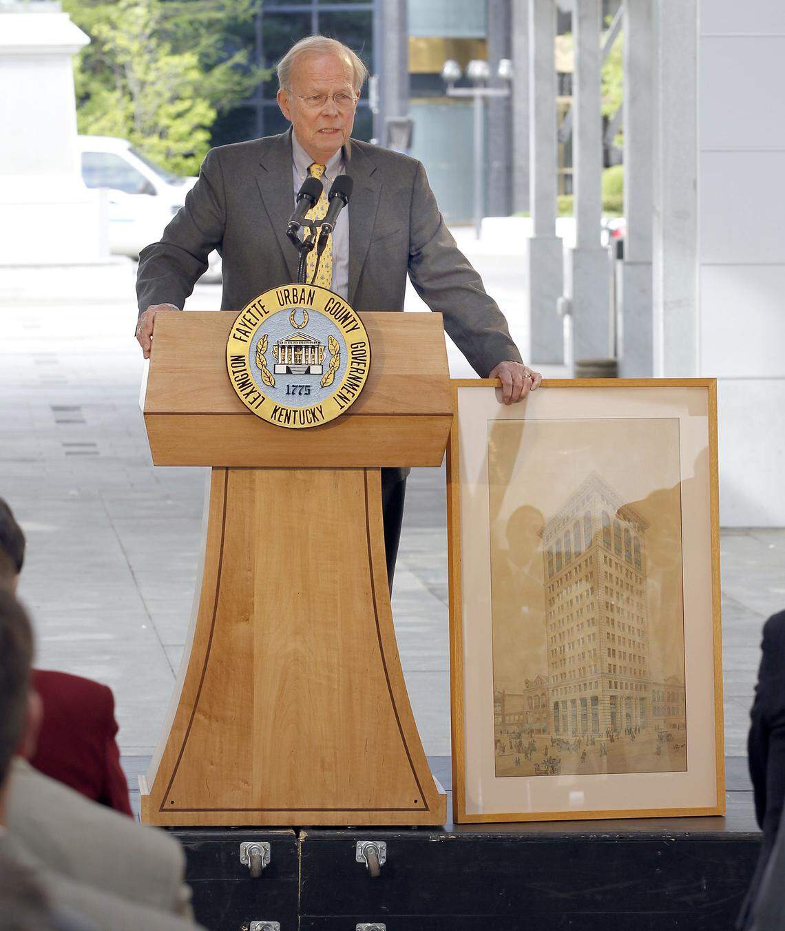 Former Mayor Foster Pettit held a 1913 watercolor of the building at the 2012 news conference announcing the coming hotel. The building was Lexington's first skyscraper and was once owned by Pettit.    