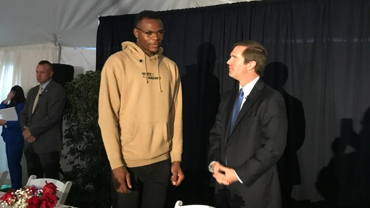University of Kentucky basketball player Oscar Tshiebwe talked with Gov. Andy Beshear before both spoke during Wednesday’s 2022 Governor’s Prayer Breakfast in Frankfort.