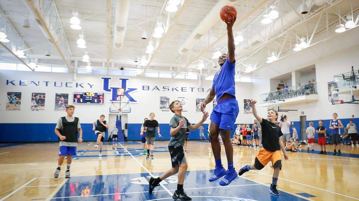 UK men’s basketball player Oscar Tshiebwe shoots a basket over young players during the Three-Day Camp Cal youth basketball camp at the Joe Craft Center in Lexington, Ky., Tuesday, June 29, 2021.