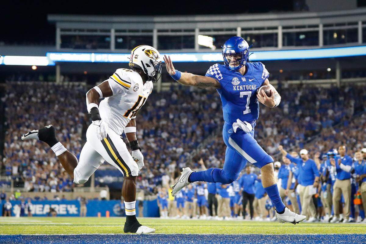 Kentucky quarterback Will Levis (7) ran by Missouri linebacker Devin Nicholson (11) en route to a touchdown in UK’s 35-28 victory over Mizzou last season at Kroger Field.