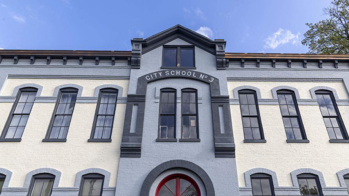 Millstone, the new restaurant and bar is inside historic Dudley Square, photographed Thursday, Sept. 26, 2025, in Lexington, Ky. The building was built in 1881 as Public School #3, and served that purpose until 1932. It was renovated in 1979 as a mix of commercial, dining, retail and office space. There’s a small parking lot to the side of the building and a larger lot across the street on South Mill. Plus, there is street parking that typically opens up in the evening. 