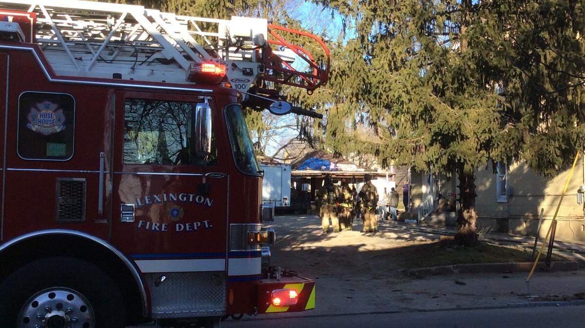 Firefighters worked at a residence on West Short Street, where an explosion and fire were reported Saturday afternoon. At least two people were taken to a hospital with injuries that may be life-threatening.
