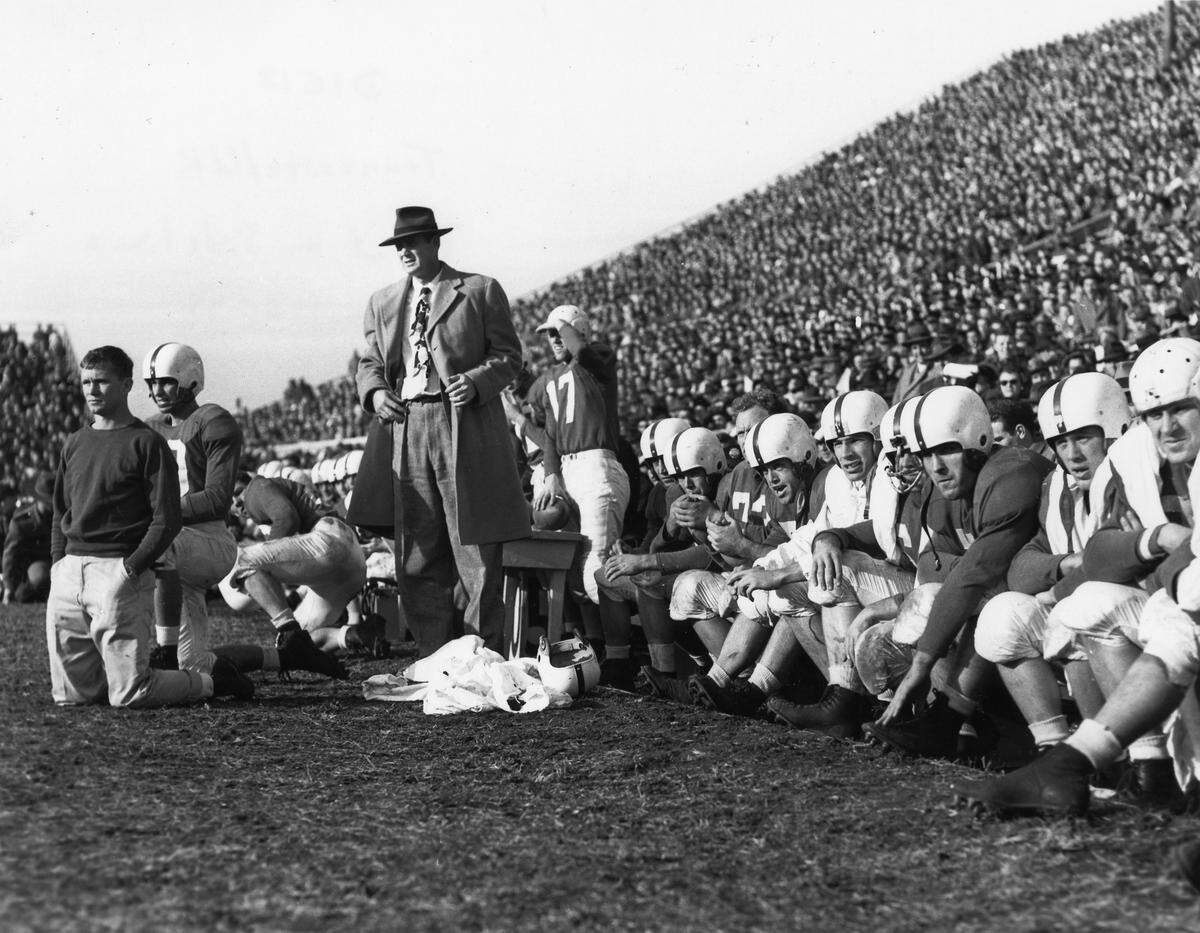 Bear Bryant (foreground in suit) on the Kentucky sideline during UK's 6-0 loss to Tennessee in 1949. It took Bryant eight tries as Wildcats head man before he finally got a victory over the Volunteers, 27-21 in 1953.