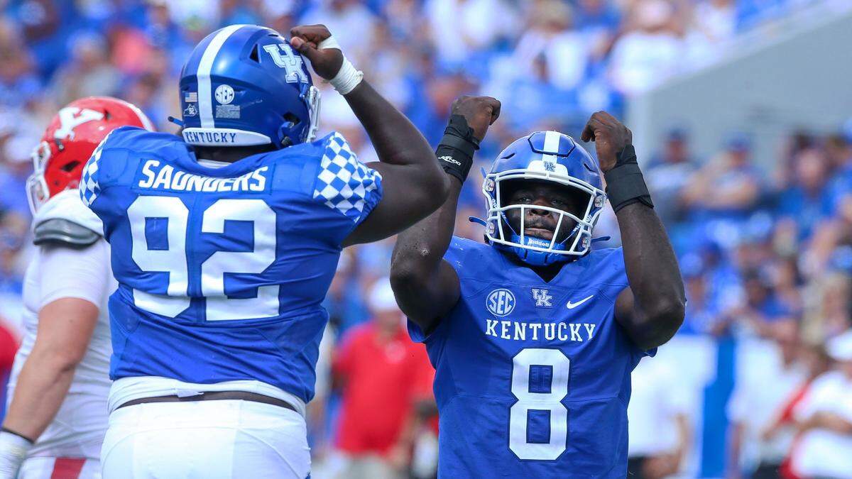 Kentucky Wildcats defensive tackle Octavious Oxendine (8), right, and Kentucky Wildcats defensive lineman Kahlil Saunders (92) celebrate a second half sack during a football game against Youngstown St. at Kroger Field in Lexington, Ky., Saturday, Sept. 17, 2022.