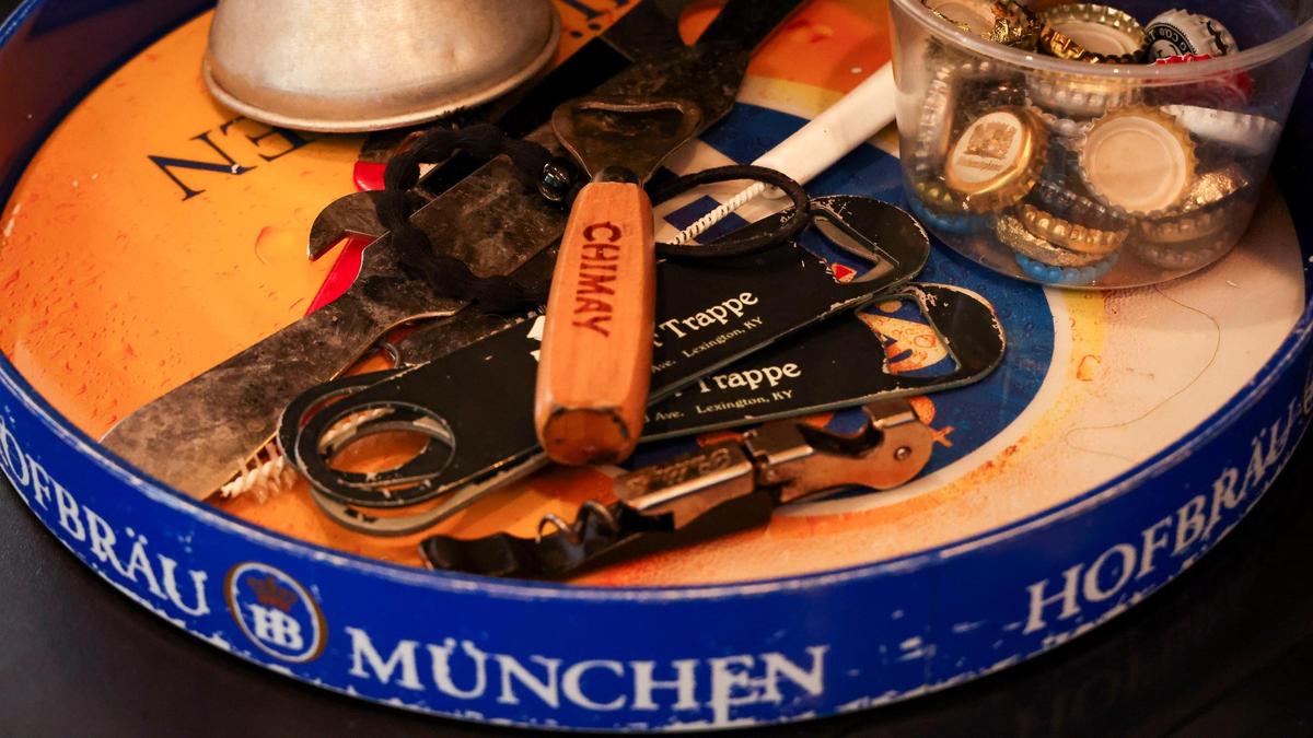 Bottle openers sit behind the bar at The Beer Trappe which specializes in ultra-premium beers that are made and distributed in very small quantities.