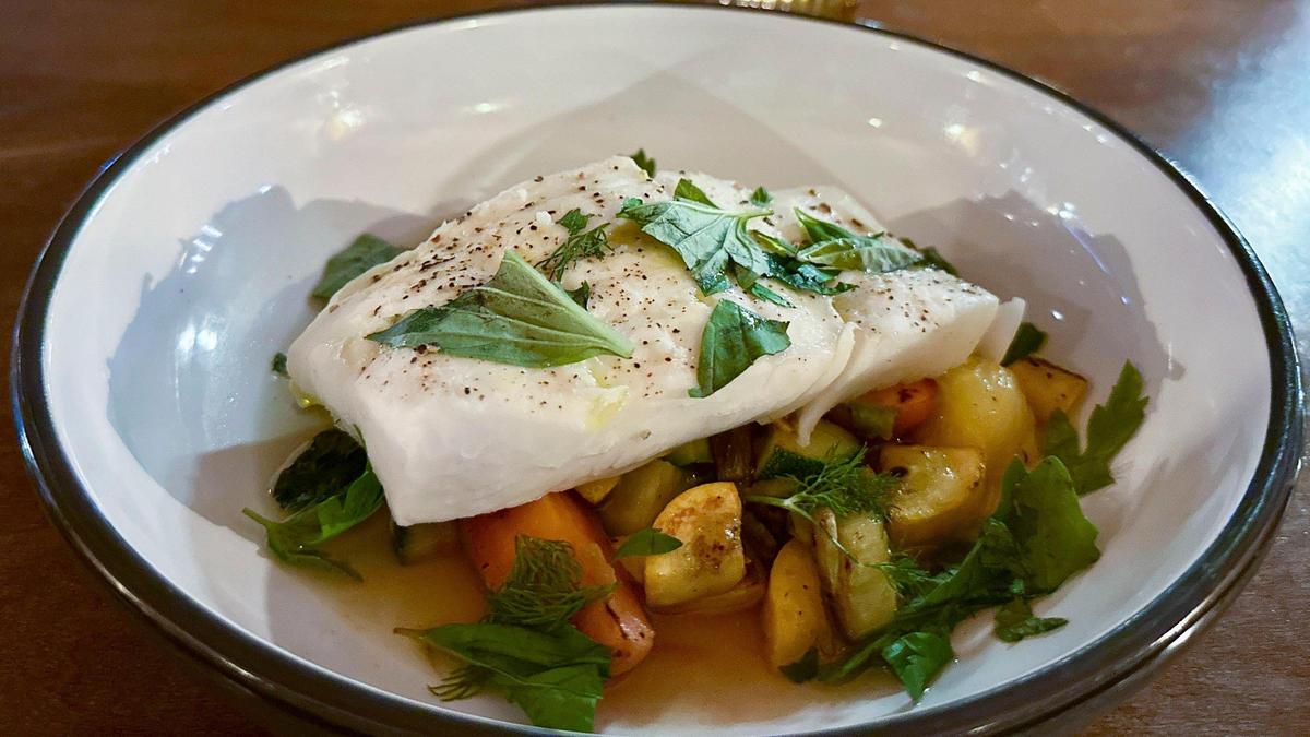 Gently poached halibut ($56) with a miso glaze, farmer’s market vegetables, poaching sage and soft herbs at Mileta. Co-owner Dallas Rose said he’s “proud of the quality and execution that we’re doing for the volume of diners that we’re doing. To me, you see this kind of food in restaurants that have like 50 seats, but there’s not a lot that are doing 300 covers on a Saturday where the quality doesn’t fall off.”