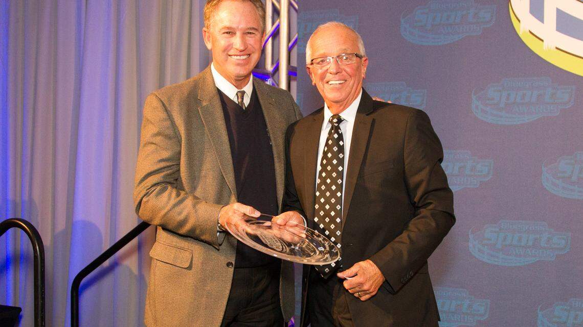 Former Cincinnati Reds player Doug Flynn, left, presented announcer Marty Brennaman the Tom Hammond Sports Media Award Wednesday.