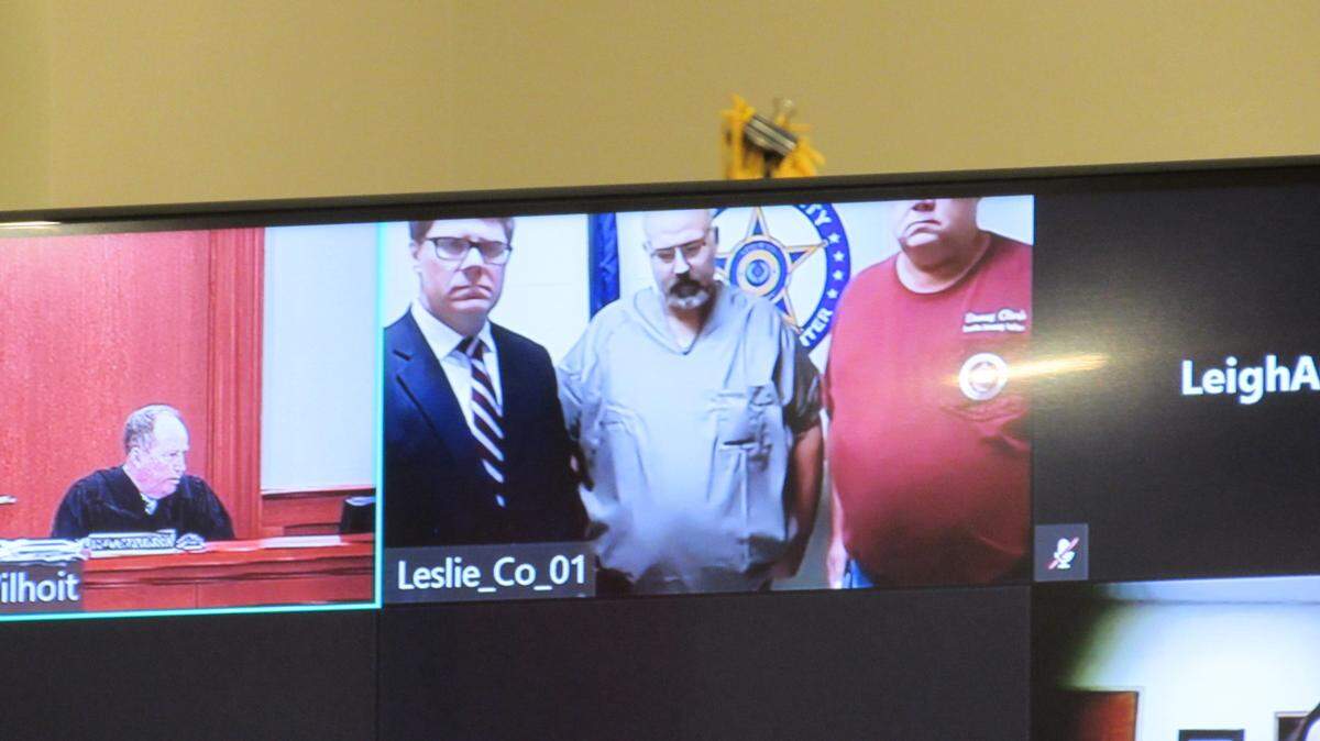 Sheriff Shawn “Mickey” Stines (center) appeared virtually in a Carter County courtroom Sept. 25, 2024. Stines is charged with killing District Judge Kevin Mullins in Mullins’ office in the Letcher County courthouse on Sept. 19. Stines has pleaded not guilty. Carter County District Judge Rupert Willhoit III (left) is the presiding judge