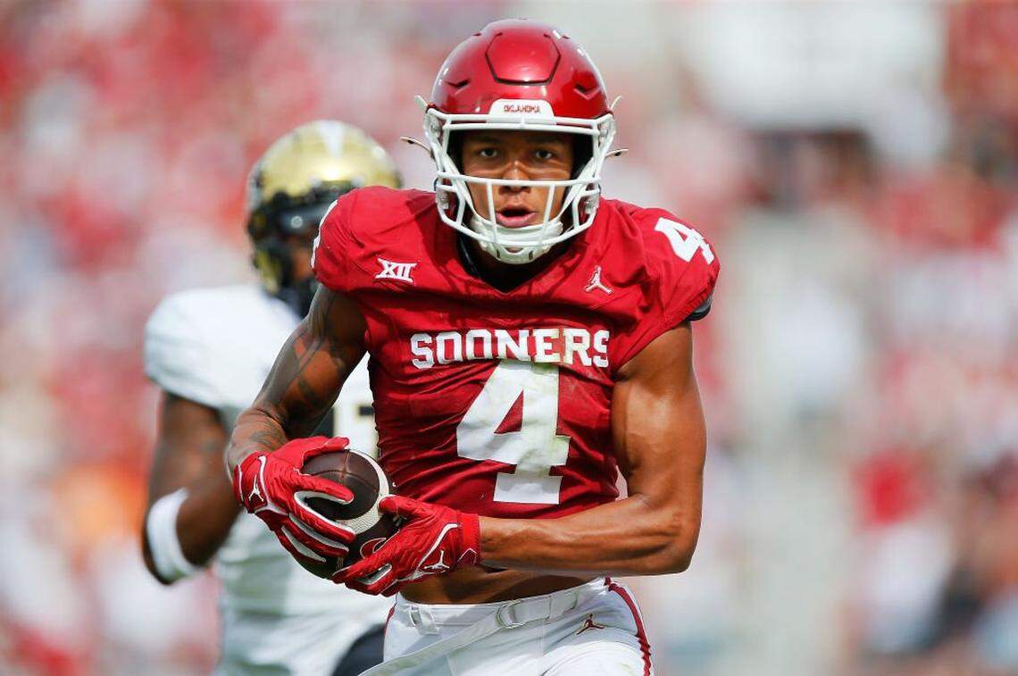 NORMAN, OKLAHOMA - OCTOBER 21: Wide receiver Nic Anderson #4 of the Oklahoma Sooners catches takes a pass for a 42-yard touchdown against defensive back Decorian Patterson #11 of the UCF Knights at Gaylord Family Oklahoma Memorial Stadium on October 21, 2023 in Norman, Oklahoma. The score is tied 17-17 at the half. (Photo by Brian Bahr/Getty Images)