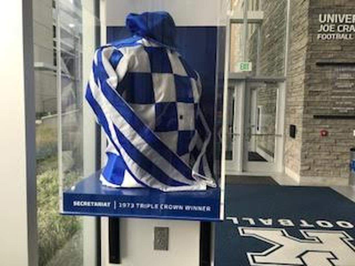 The lobby of the University of Kentucky’s Joe Craft Football Training Facility includes this copy of the Meadow Stable racing silks Secretariat wore en route to the 1973 Triple Crown.
